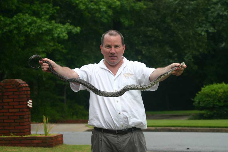 Jim holding the snake by both ends